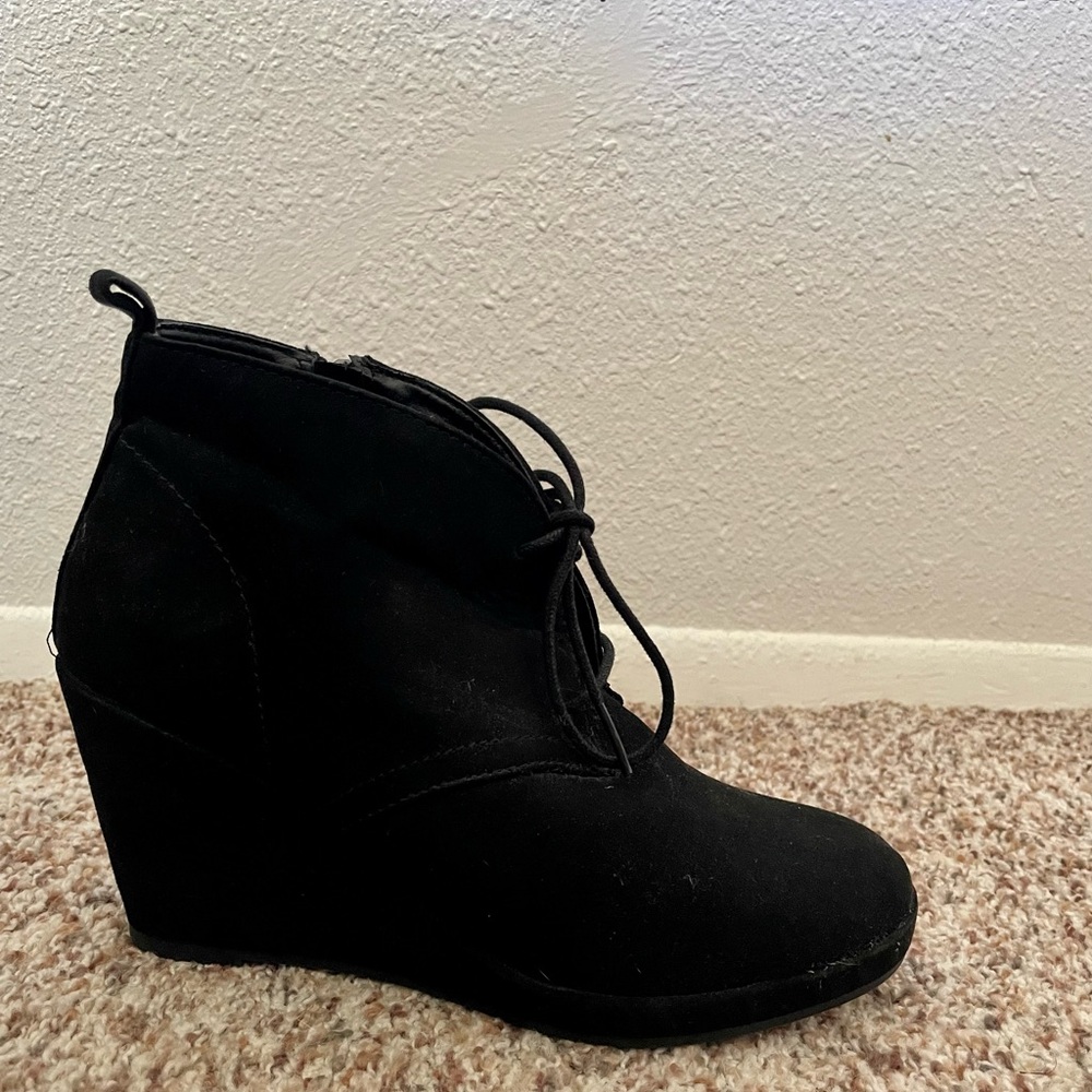 Black wedge booties.